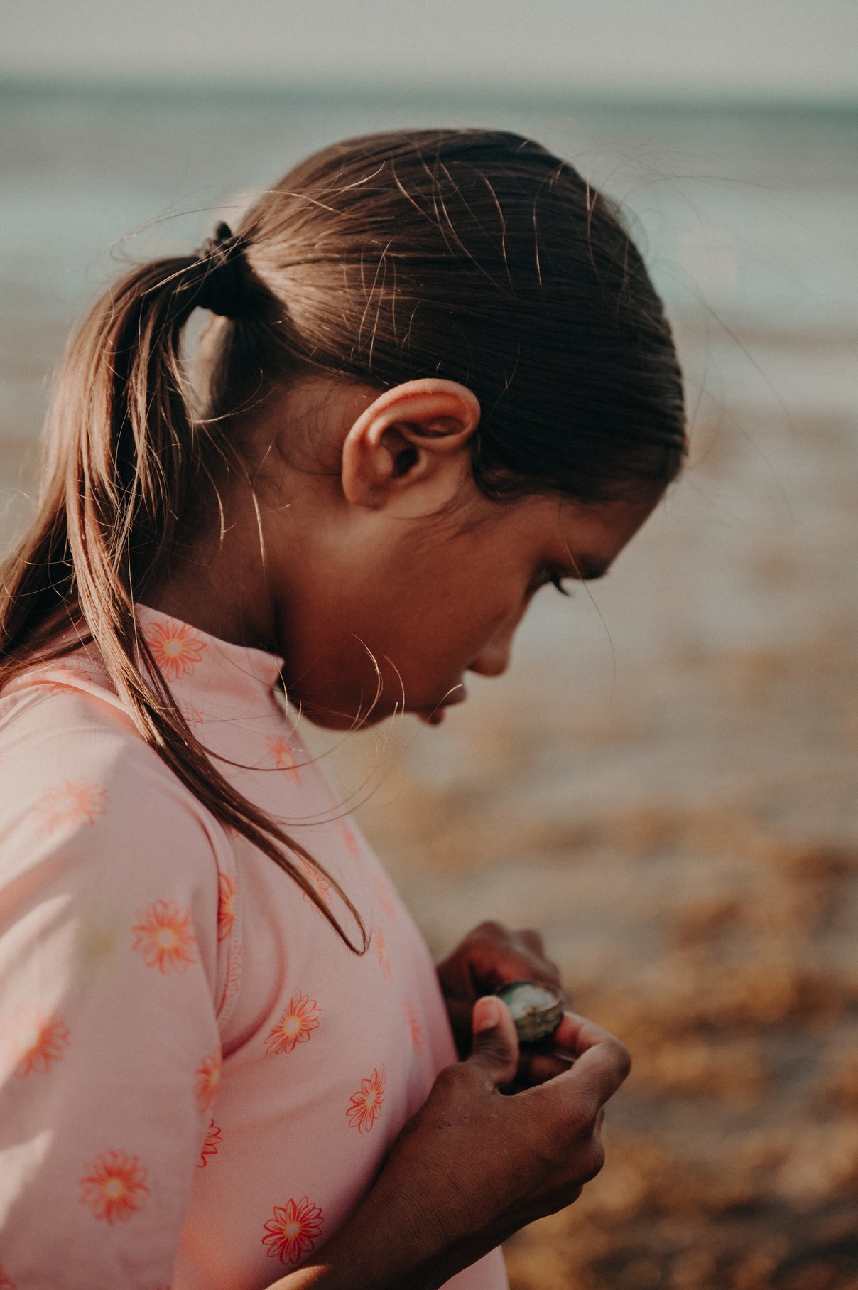 Portrait of a Young Girl Holding a Seashell